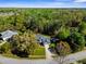 Aerial view of the home showcasing its location surrounded by lush greenery at 11227 Lakeview Dr, New Port Richey, FL 34654
