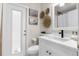 Bright bathroom with a clean white vanity, modern fixtures, and stylish decor at 11227 Lakeview Dr, New Port Richey, FL 34654