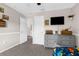 Cozy bedroom with grey dresser and wall-mounted television at 11227 Lakeview Dr, New Port Richey, FL 34654