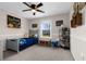Charming bedroom with wainscoting and a dinosaur theme at 11227 Lakeview Dr, New Port Richey, FL 34654