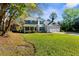 Charming two-story home with a well-manicured lawn and inviting front porch at 11227 Lakeview Dr, New Port Richey, FL 34654