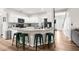 Bright kitchen with white cabinets, center island, and modern fixtures perfect for cooking at 11227 Lakeview Dr, New Port Richey, FL 34654