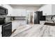 Modern kitchen featuring granite countertops, subway tile backsplash, and stainless steel appliances at 11227 Lakeview Dr, New Port Richey, FL 34654