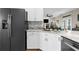 Bright kitchen with granite countertops and stainless steel appliances at 11227 Lakeview Dr, New Port Richey, FL 34654
