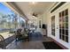 Relaxing screened-in patio with comfortable seating and outdoor view at 11227 Lakeview Dr, New Port Richey, FL 34654