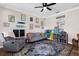 Bright playroom with a sofa, wall art, and plenty of space for toys and activities at 11227 Lakeview Dr, New Port Richey, FL 34654