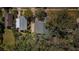 Aerial view of home's location, showcasing its proximity to neighboring houses and lush foliage at 120 Read St, Tarpon Springs, FL 34689