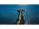 Scenic aerial view of a long road leading to an island surrounded by sparkling blue water, emphasizing tranquility at 120 Read St, Tarpon Springs, FL 34689