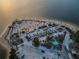 Aerial view of a sandy park area with palm trees, parking and beach, ideal for leisure and outdoor activities at 120 Read St, Tarpon Springs, FL 34689