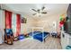 bedroom with ceiling fan, window, light walls, and a custom play bed at 120 Read St, Tarpon Springs, FL 34689