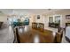 Spacious dining room with wood floors, large table and chairs, and open access to the kitchen at 120 Read St, Tarpon Springs, FL 34689