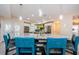 Bright kitchen showcasing a granite-topped island with seating and modern pendant lighting above at 120 Read St, Tarpon Springs, FL 34689