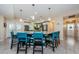 Modern kitchen featuring a large center island with seating, pendant lighting, and granite countertops at 120 Read St, Tarpon Springs, FL 34689