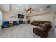 Cozy living room with a fireplace, ceiling fan, recessed lighting, and comfortable seating at 120 Read St, Tarpon Springs, FL 34689