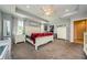 Bright main bedroom with a ceiling fan, large windows and ample furniture at 120 Read St, Tarpon Springs, FL 34689