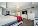 Spacious main bedroom featuring a tray ceiling, carpet floors, a ceiling fan, and stylish, white dressers at 120 Read St, Tarpon Springs, FL 34689