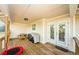The covered porch is spacious and features a grill, patio furniture, and backyard views at 120 Read St, Tarpon Springs, FL 34689