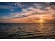 Beautiful sunset over the water with vibrant colors in the sky, highlighting the scenic beauty at 120 Read St, Tarpon Springs, FL 34689
