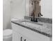 Bathroom featuring granite countertop and modern black faucet at 12112 Shearwater Dr, New Port Richey, FL 34654