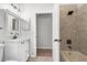 Bathroom showcasing vanity with gray granite and tile shower at 12112 Shearwater Dr, New Port Richey, FL 34654