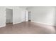 Bright bedroom with neutral tones, tile floor, and closet at 12112 Shearwater Dr, New Port Richey, FL 34654