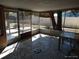 Enclosed sunroom area with mosaic tile flooring and outdoor views at 12716 Mulberry Ln, Hudson, FL 34667