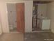 Laundry room area with washer and dryer, and adjacent access to bathroom at 12716 Mulberry Ln, Hudson, FL 34667
