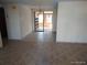 Living room space featuring tile floor and view into the Florida room at 12716 Mulberry Ln, Hudson, FL 34667