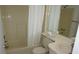 Cozy bathroom featuring a shower/tub combo, toilet, and a vanity with sink and mirror at 12816 Wedgewood Way # D, Hudson, FL 34667