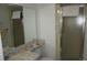 Standard bathroom featuring a shower and marble-like countertop at 12816 Wedgewood Way # D, Hudson, FL 34667