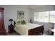 Bedroom with a queen-sized bed, providing comfortable rest, and featuring a ceiling fan at 12816 Wedgewood Way # D, Hudson, FL 34667