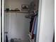 Organized closet with clothes hanging and shoes neatly lined up on the floor at 12816 Wedgewood Way # D, Hudson, FL 34667