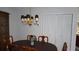 Formal dining room featuring a classic wood table with seating for six and chandelier lighting at 12816 Wedgewood Way # D, Hudson, FL 34667