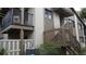 Exterior of condominium showing staircase, balcony and air conditioning unit at 12816 Wedgewood Way # D, Hudson, FL 34667