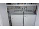 The laundry room area features a newer washer and dryer with shelving at 12816 Wedgewood Way # D, Hudson, FL 34667