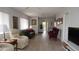 Bright, open living room with tile floors offers ample space for entertaining at 12816 Wedgewood Way # D, Hudson, FL 34667