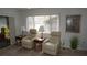 Chairs and recliners overlook the beautiful backyard at 12816 Wedgewood Way # D, Hudson, FL 34667