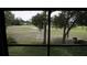 A view from inside the home of the manicured golf course at 12816 Wedgewood Way # D, Hudson, FL 34667