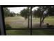 A view from inside the home of the manicured golf course at 12816 Wedgewood Way # D, Hudson, FL 34667