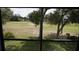 A view from inside the home of the manicured golf course at 12816 Wedgewood Way # D, Hudson, FL 34667