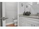 Charming half-bathroom boasts tile floors, granite counters, and modern fixtures at 13186 Road Runner Ave, Weeki Wachee, FL 34614