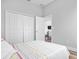 Bright bedroom featuring closet, natural light, and modern minimalist aesthetic at 13186 Road Runner Ave, Weeki Wachee, FL 34614