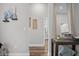 Neutral hallway with wood floors, stylish wall decor, and a console table, creating a seamless transition between rooms at 13186 Road Runner Ave, Weeki Wachee, FL 34614