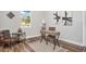 Comfortable home office with a desk, a large window, and stylish decor, offering a productive workspace at 13186 Road Runner Ave, Weeki Wachee, FL 34614