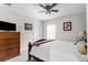 Relaxing bedroom featuring natural light, a ceiling fan, and ample storage space at 13414 English Parrot Rd, Brooksville, FL 34614