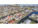 Aerial view of waterfront neighborhood featuring canals, docks, and homes in a coastal community at 13604 Maria Dr, Hudson, FL 34667