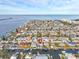 Aerial view of a waterfront home surrounded by canals in a residential neighborhood, highlighting coastal living at 13604 Maria Dr, Hudson, FL 34667