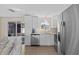 Kitchen with a peninsula countertop, stainless steel appliances, recessed lighting, and updated cabinets at 13604 Maria Dr, Hudson, FL 34667