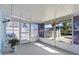 Enclosed sun room with screened windows to let the sunshine in at 13604 Maria Dr, Hudson, FL 34667