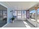 Enclosed sun room with screened windows to let the sunshine in at 13604 Maria Dr, Hudson, FL 34667